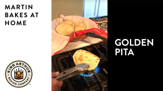 Grilling pita on gas stove flame